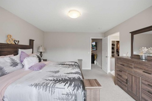 52 Sunrise Way, Cochrane, AB - Indoor Photo Showing Bedroom