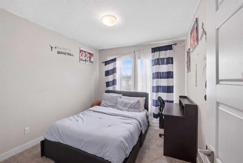 52 Sunrise Way, Cochrane, AB - Indoor Photo Showing Bedroom