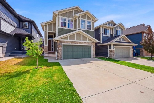 52 Sunrise Way, Cochrane, AB - Outdoor With Facade