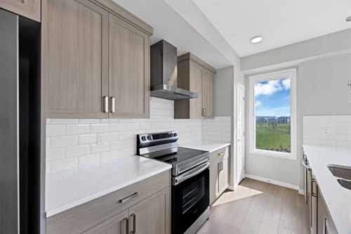 3315-33 Carringham Gate Nw, Calgary, AB - Indoor Photo Showing Kitchen With Stainless Steel Kitchen With Double Sink With Upgraded Kitchen