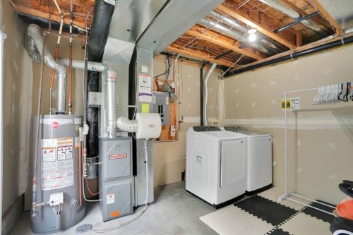 199 Cedarwood Lane Sw, Calgary, AB - Indoor Photo Showing Laundry Room