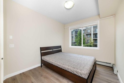 108-22 Panatella Road Nw, Calgary, AB - Indoor Photo Showing Bedroom