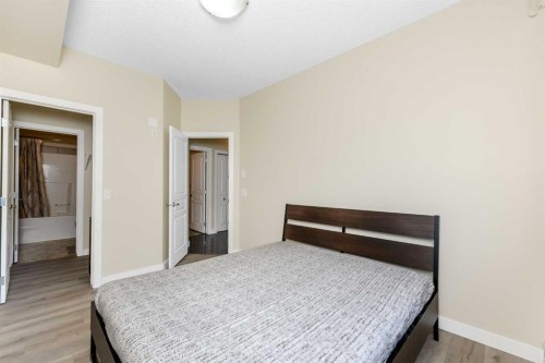 108-22 Panatella Road Nw, Calgary, AB - Indoor Photo Showing Bedroom