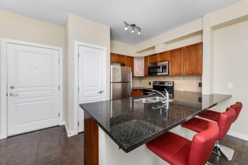 108-22 Panatella Road Nw, Calgary, AB - Indoor Photo Showing Kitchen With Double Sink