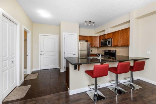 108-22 Panatella Road Nw, Calgary, AB - Indoor Photo Showing Kitchen With Double Sink