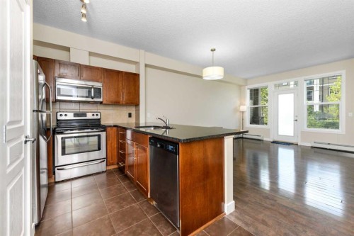 108-22 Panatella Road Nw, Calgary, AB - Indoor Photo Showing Kitchen With Stainless Steel Kitchen