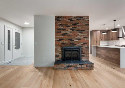 6460 Silver Ridge Way Nw, Calgary, AB - Indoor Photo Showing Living Room With Fireplace