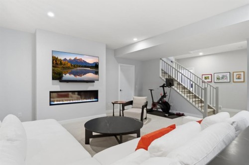 648 Shawnee Terrace Sw, Calgary, AB - Indoor Photo Showing Living Room With Fireplace