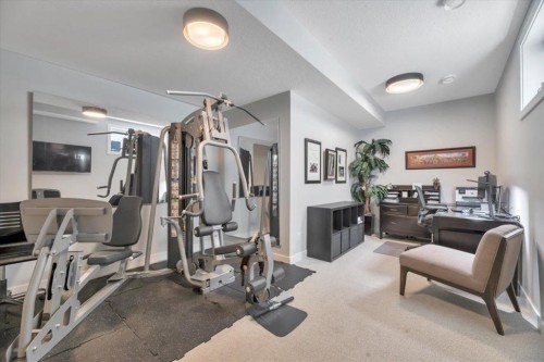 648 Shawnee Terrace Sw, Calgary, AB - Indoor Photo Showing Gym Room