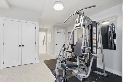 648 Shawnee Terrace Sw, Calgary, AB - Indoor Photo Showing Gym Room