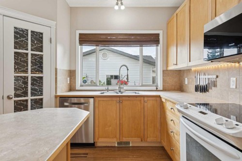 1857 New Brighton Drive Se, Calgary, AB - Indoor Photo Showing Kitchen With Double Sink