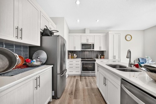 122 Cityside Way Ne, Calgary, AB - Indoor Photo Showing Kitchen With Double Sink With Upgraded Kitchen