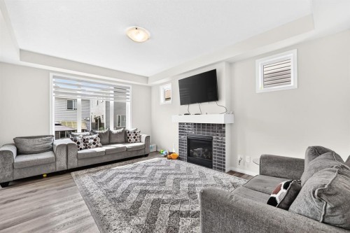 122 Cityside Way Ne, Calgary, AB - Indoor Photo Showing Living Room With Fireplace