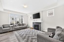 122 Cityside Way Ne, Calgary, AB  - Indoor Photo Showing Living Room With Fireplace 