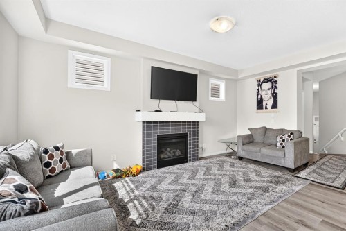 122 Cityside Way Ne, Calgary, AB - Indoor Photo Showing Living Room With Fireplace