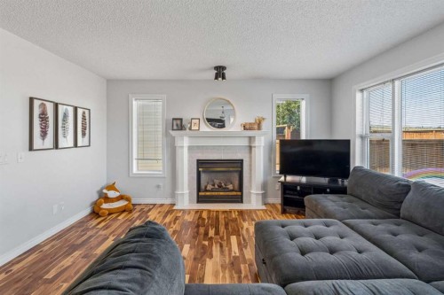 150 Hidden Hills Terrace Nw, Calgary, AB - Indoor Photo Showing Living Room With Fireplace