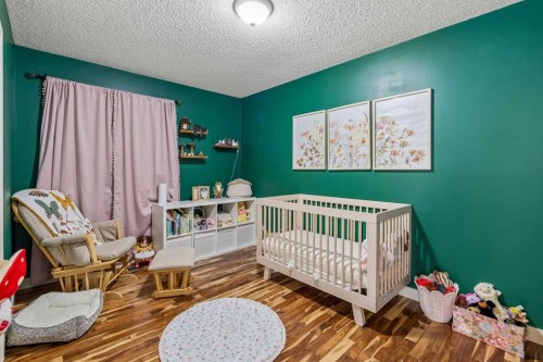 150 Hidden Hills Terrace Nw, Calgary, AB - Indoor Photo Showing Bedroom