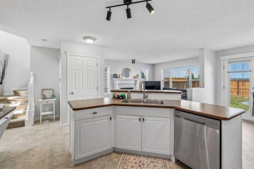 150 Hidden Hills Terrace Nw, Calgary, AB - Indoor Photo Showing Kitchen With Double Sink