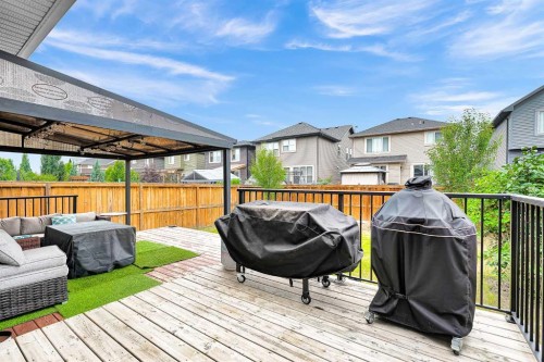 154 Buckskin Way, Cochrane, AB - Outdoor With Deck Patio Veranda With Exterior
