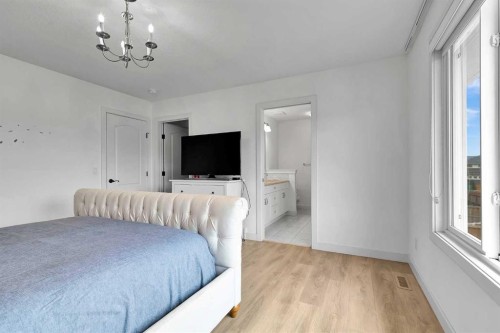 154 Buckskin Way, Cochrane, AB - Indoor Photo Showing Bedroom