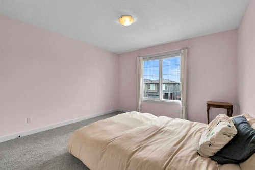 154 Buckskin Way, Cochrane, AB - Indoor Photo Showing Bedroom