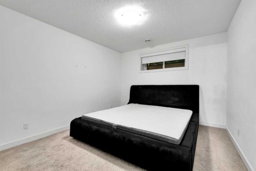 154 Buckskin Way, Cochrane, AB - Indoor Photo Showing Bedroom