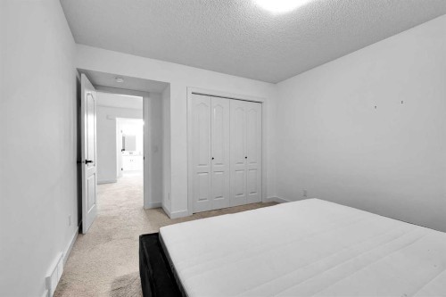 154 Buckskin Way, Cochrane, AB - Indoor Photo Showing Bedroom