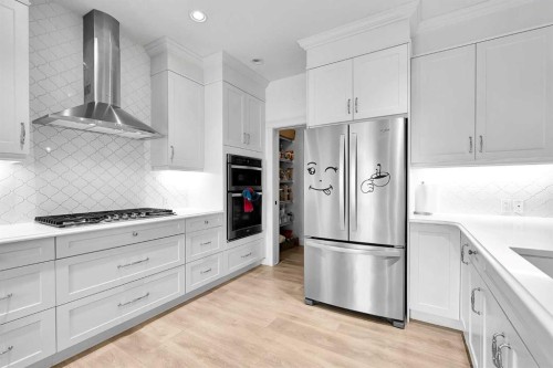 154 Buckskin Way, Cochrane, AB - Indoor Photo Showing Kitchen With Stainless Steel Kitchen With Upgraded Kitchen