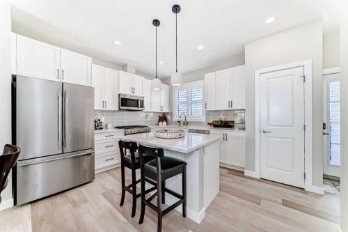 116 Precedence Way, Cochrane, AB - Indoor Photo Showing Kitchen With Upgraded Kitchen