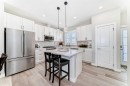 116 Precedence Way, Cochrane, AB  - Indoor Photo Showing Kitchen With Upgraded Kitchen 