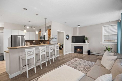 118-3600 15A Street Sw, Calgary, AB - Indoor With Fireplace
