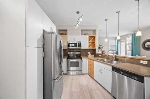 118-3600 15A Street Sw, Calgary, AB - Indoor Photo Showing Kitchen With Stainless Steel Kitchen With Double Sink With Upgraded Kitchen