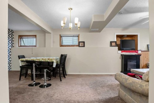 403 Shawinigan Drive Sw, Calgary, AB - Indoor With Fireplace