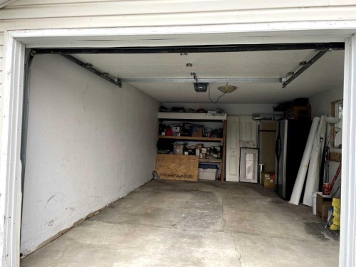 1611 Olympia Drive Se, Calgary, AB - Indoor Photo Showing Garage