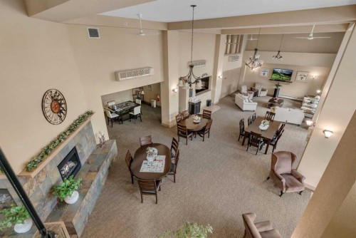 116-428 Chaparral Ravine View Se, Calgary, AB - Indoor With Fireplace