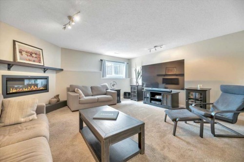 156 Aspen Creek Crescent, Strathmore, AB - Indoor Photo Showing Living Room With Fireplace