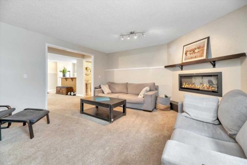 156 Aspen Creek Crescent, Strathmore, AB - Indoor Photo Showing Living Room With Fireplace