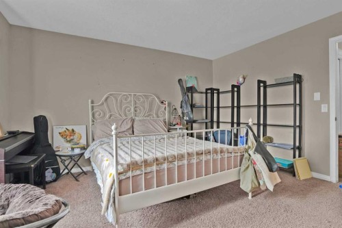 31 Walden Manor Se, Calgary, AB - Indoor Photo Showing Bedroom