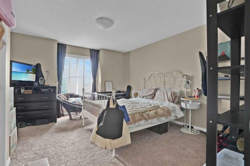31 Walden Manor Se, Calgary, AB - Indoor Photo Showing Bedroom