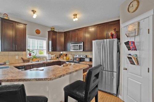 31 Walden Manor Se, Calgary, AB - Indoor Photo Showing Kitchen With Double Sink