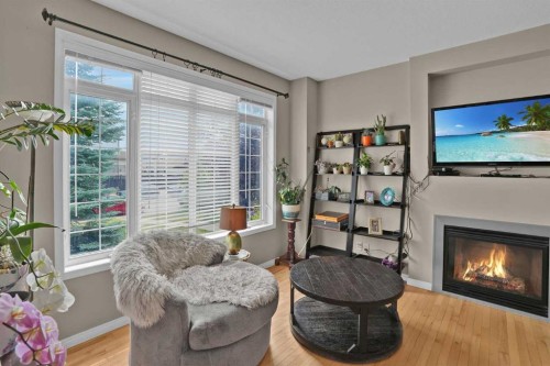 31 Walden Manor Se, Calgary, AB - Indoor Photo Showing Living Room With Fireplace