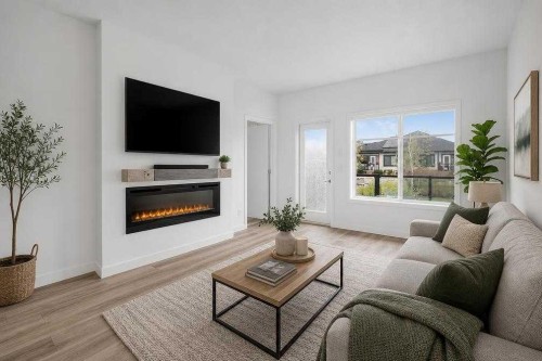 358 Marina Cove Se, Calgary, AB - Indoor Photo Showing Living Room With Fireplace