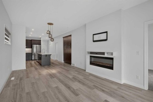 358 Marina Cove Se, Calgary, AB - Indoor With Fireplace