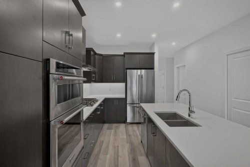 358 Marina Cove Se, Calgary, AB - Indoor Photo Showing Kitchen With Double Sink With Upgraded Kitchen