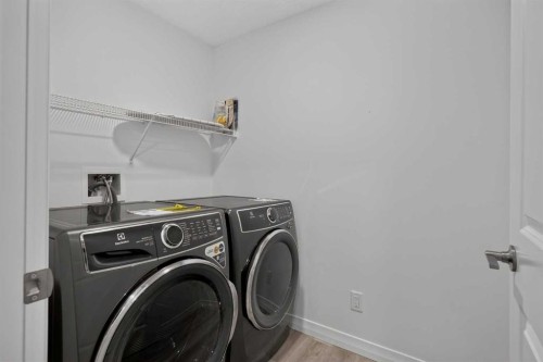 358 Marina Cove Se, Calgary, AB - Indoor Photo Showing Laundry Room