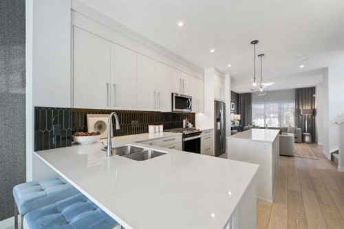 9941 Huxbury Drive Ne, Calgary, AB - Indoor Photo Showing Kitchen With Stainless Steel Kitchen With Double Sink With Upgraded Kitchen
