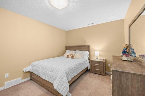 207 Hamptons Drive Nw, Calgary, AB - Indoor Photo Showing Bedroom