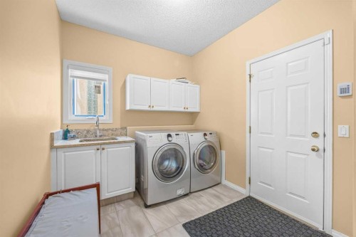 207 Hamptons Drive Nw, Calgary, AB - Indoor Photo Showing Laundry Room