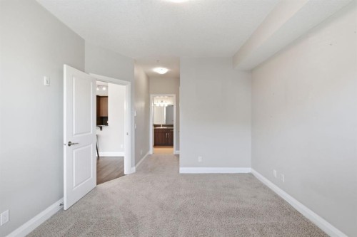 2208-15 Sunset Square, Cochrane, AB - Indoor Photo Showing Other Room