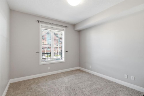 2208-15 Sunset Square, Cochrane, AB - Indoor Photo Showing Other Room